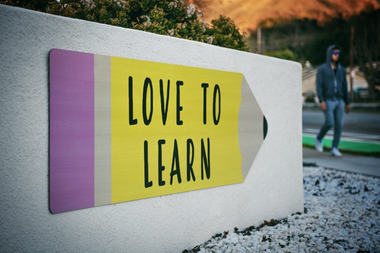 "Love to Learn" Written on Poster Shaped like a Pencil