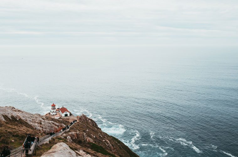 Aerial View of Lighthouse by Cliff