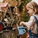 Young Girl Watering Plants