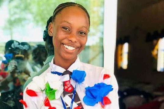 Junita H. Sangare smiles after being recognized and rewarded as one of the top 13 students in Liberia