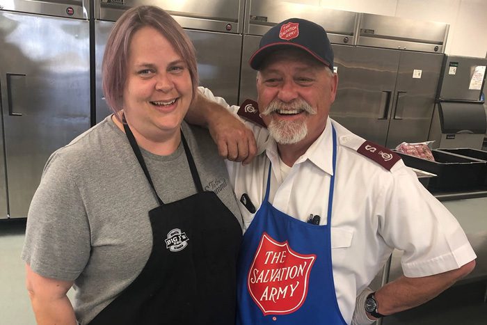 Emergency Disaster Services member and volunteer smile while preparing relief during Mat-Su Valley wildfire.