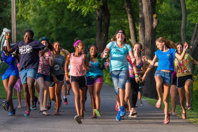 Children at camp running happily