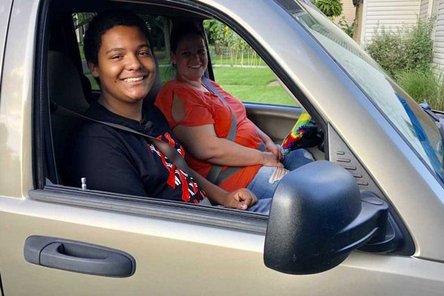 Treston Harris and Mother Sitting in New Car He Bought For Her