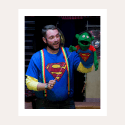 Captain Mark Davey in superman shirt with puppet wearing same shirt