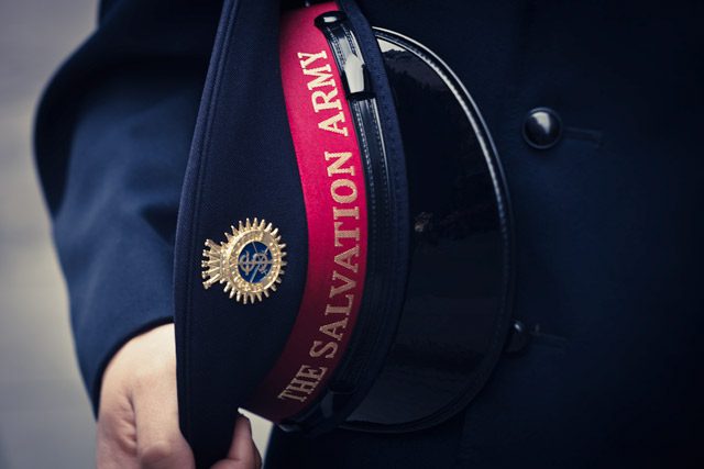 Close-up of Officer Holding Hat