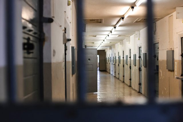 View through prison bars inside cell