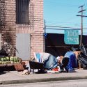 Homeless Woman by Tent on Street