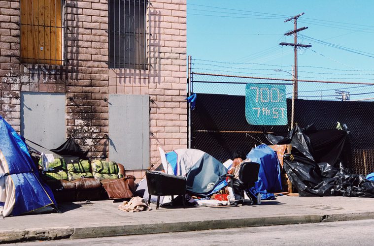 Homeless Woman by Tent on Street