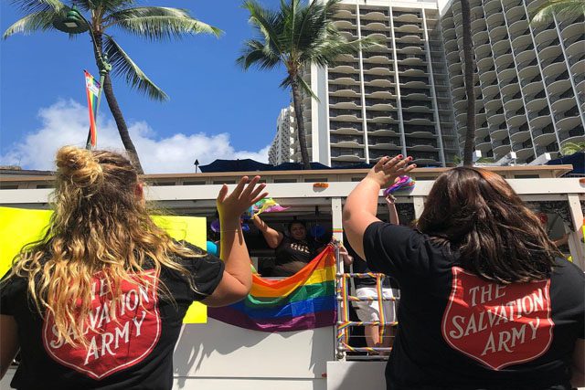 Revolution Hawaii Team Waving During Parade