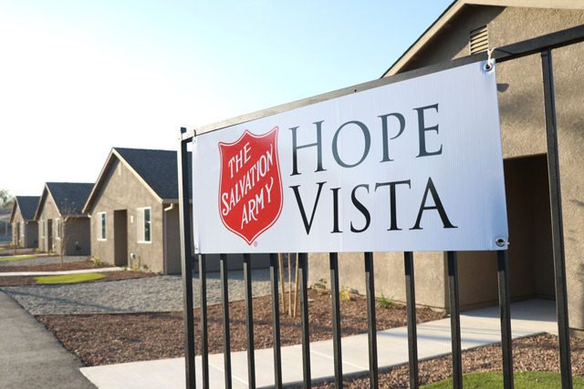 Gate with Hope Vista Sign front of Newly Built Houses