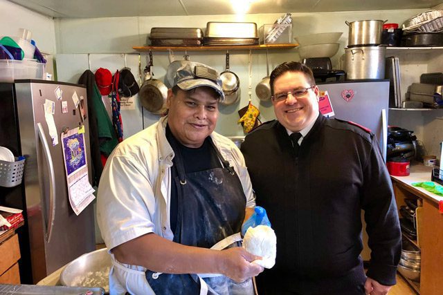 Salvation Army Officer with Chef Holding Dough