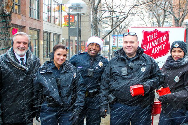 Members of Denver Police Department help as Bellringers