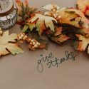 Leaves surrounding the words "give thanks"