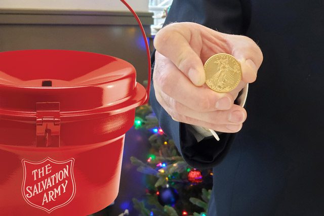 gold coin in front of red kettle