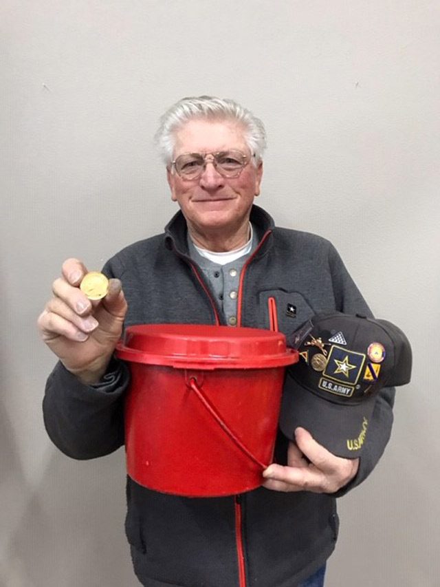 Man holding Krugerrand and kettle