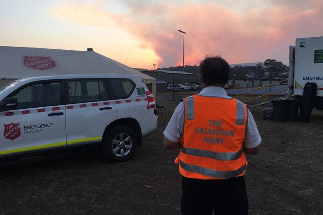 Salvation Army Emergency Worker looking at fires