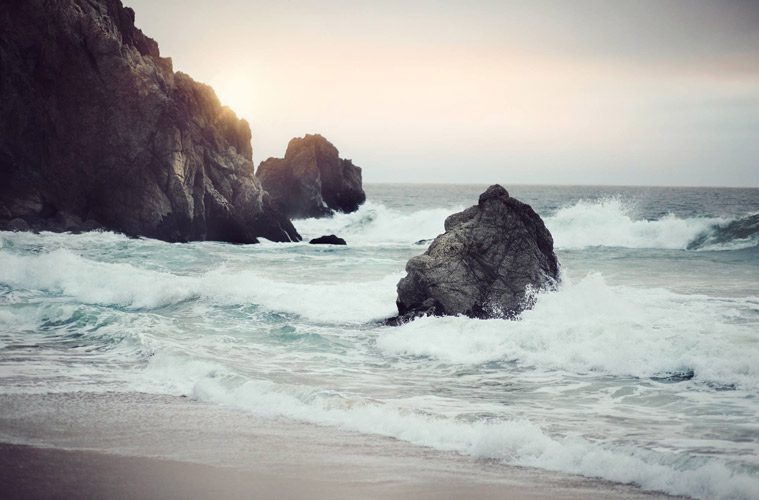 coastline with rocks with sun setting