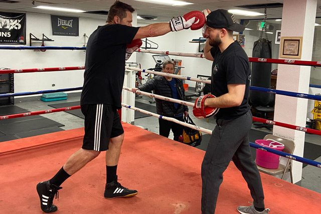 Joe Miller boxing with coach