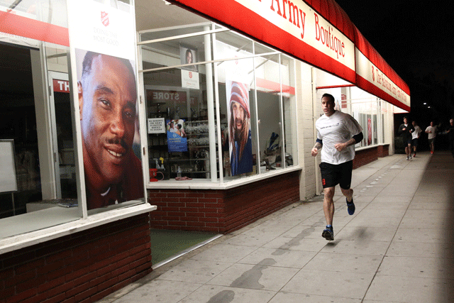 man running by salvation army store