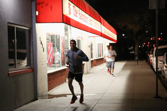 people running by salvation army store