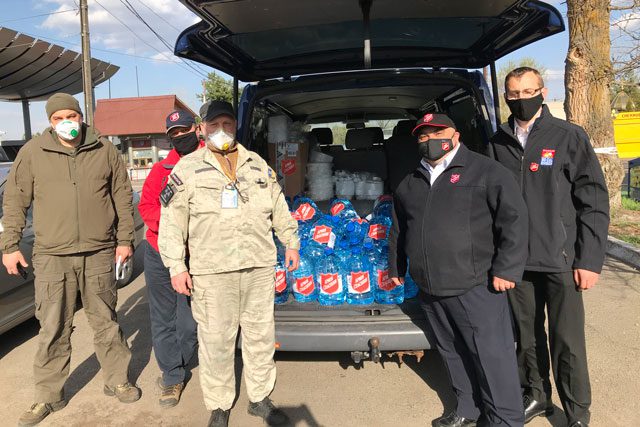 EDS workers with bottles of water