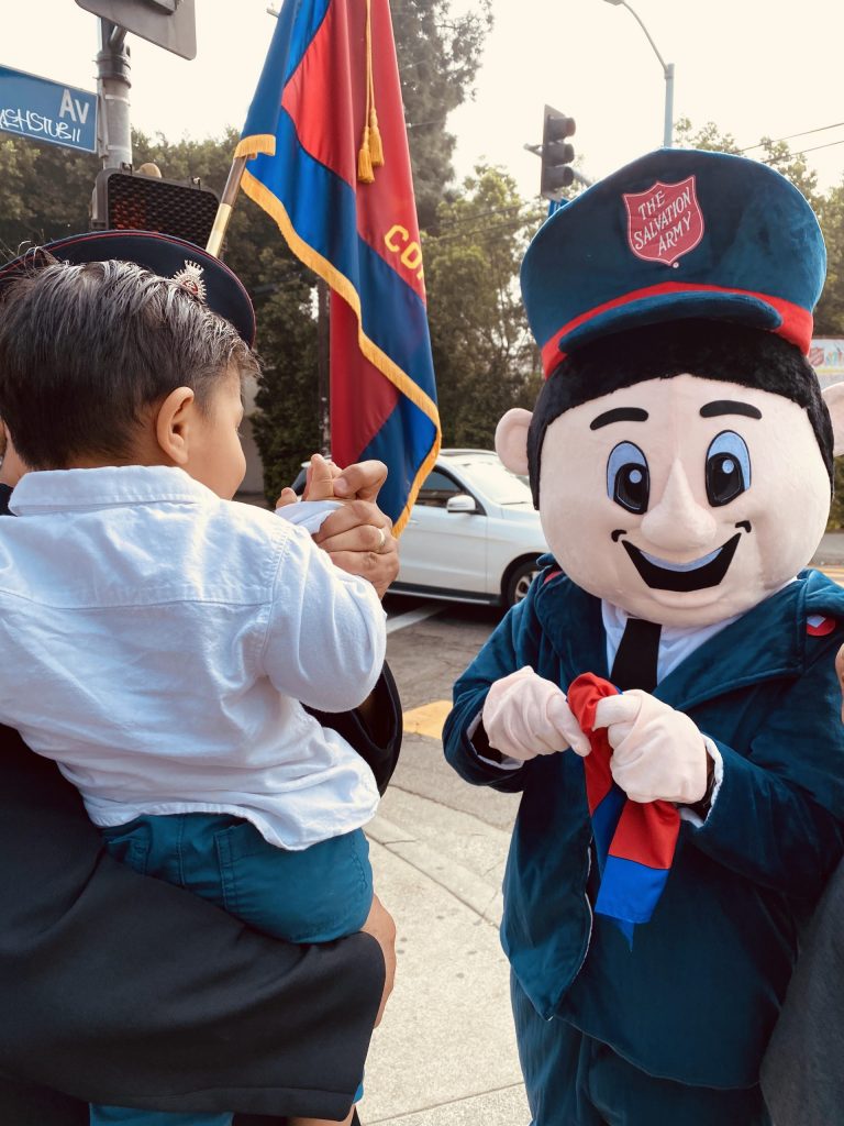 Salvation Army mascot with child
