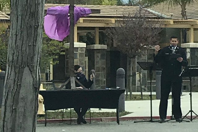 Salvation Army officer giving sermon outside