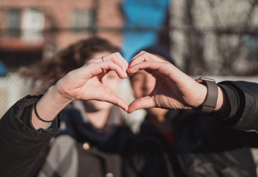 Hands together forming heart