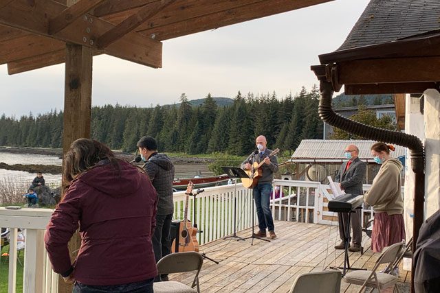 band playing on porch outside