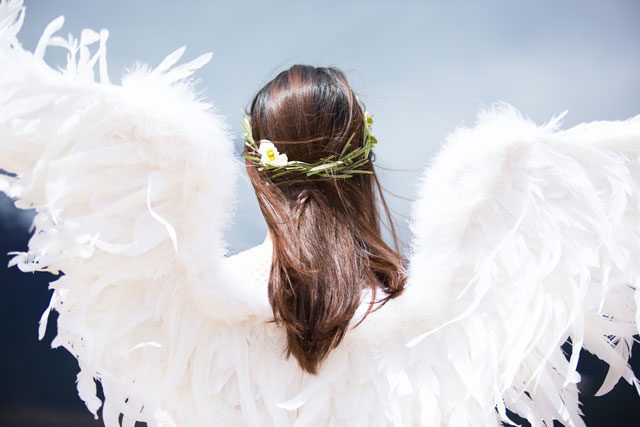 Woman wearing angel wings