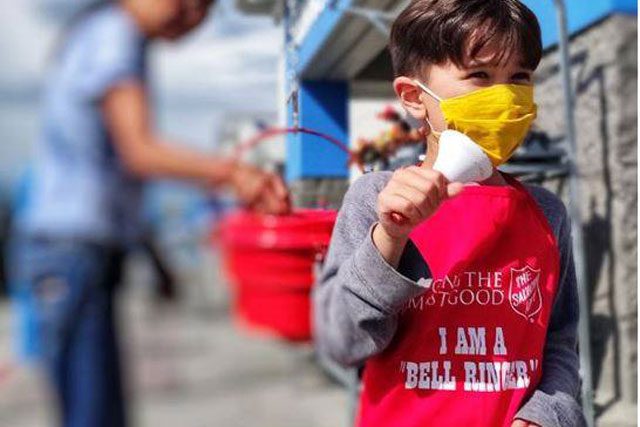 Child ringing bell at kettle