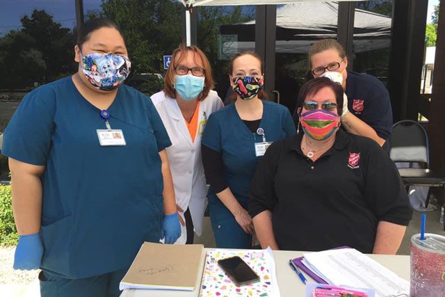 group of people with masks outside