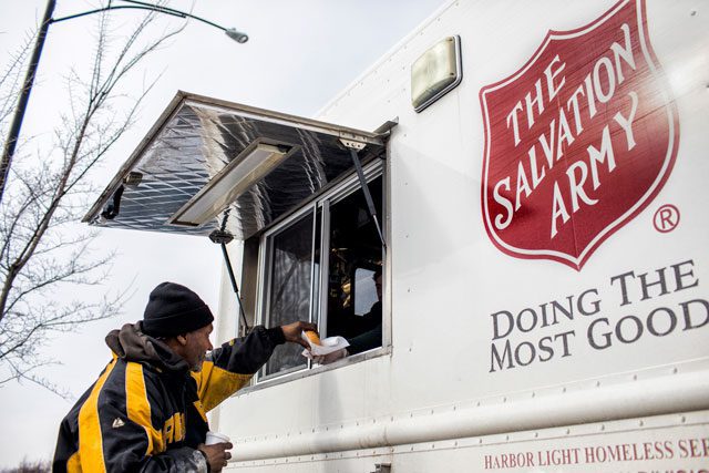 Man receiving food from van