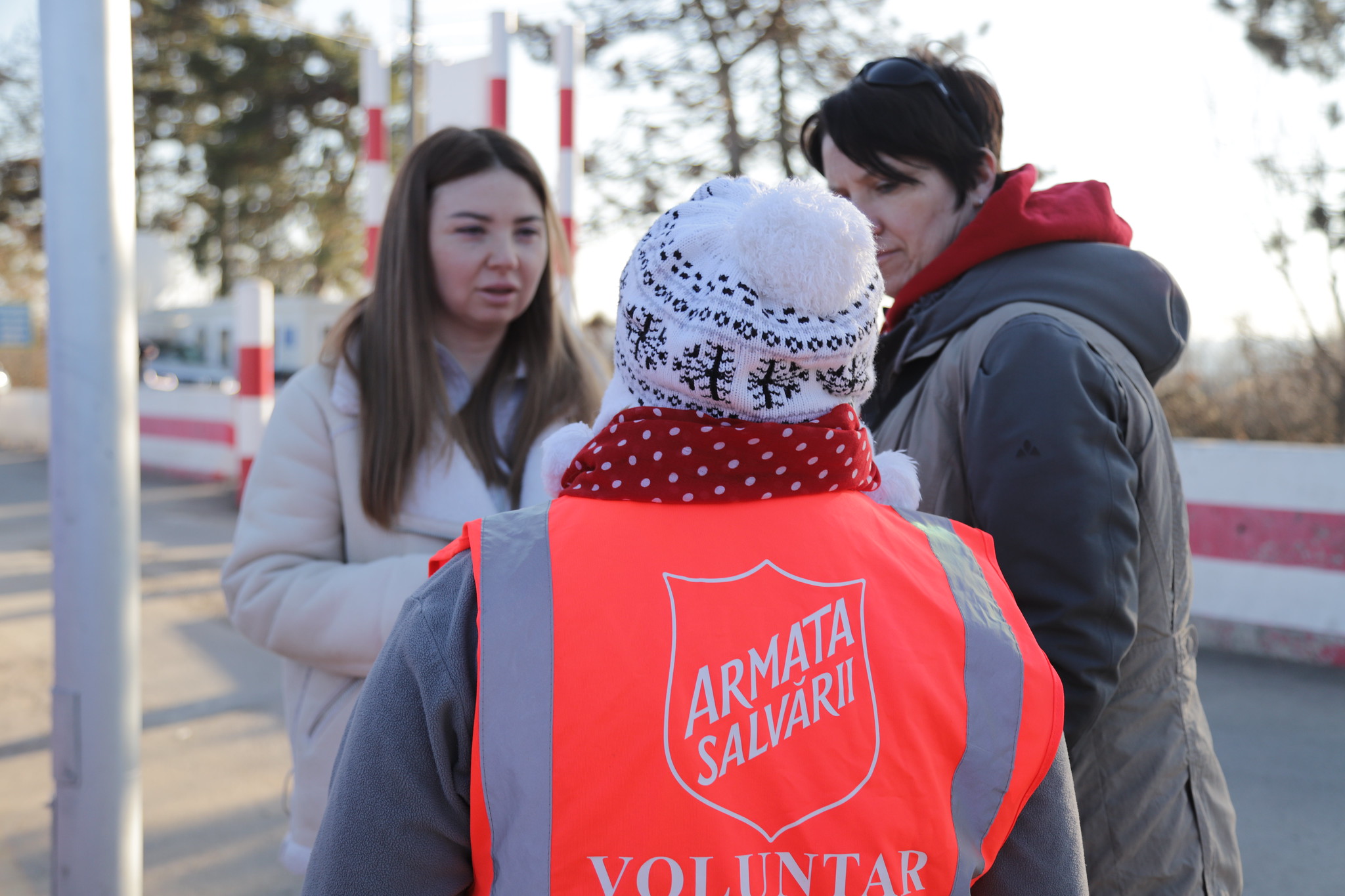 salvation army volunteer speaks with refugees in ukraine