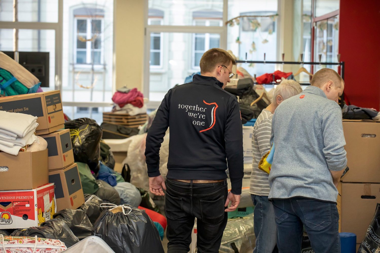 volunteers sort through donations in ukraine
