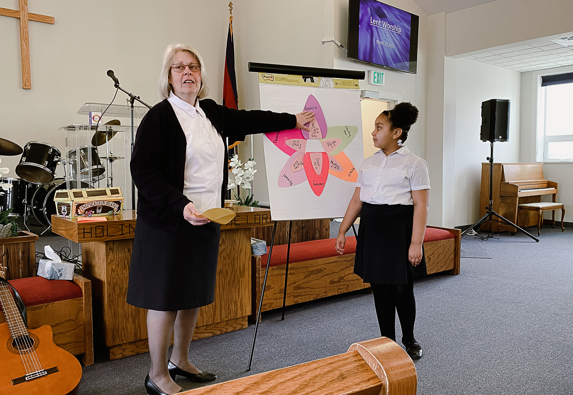 female salvation army officer teaches bible study