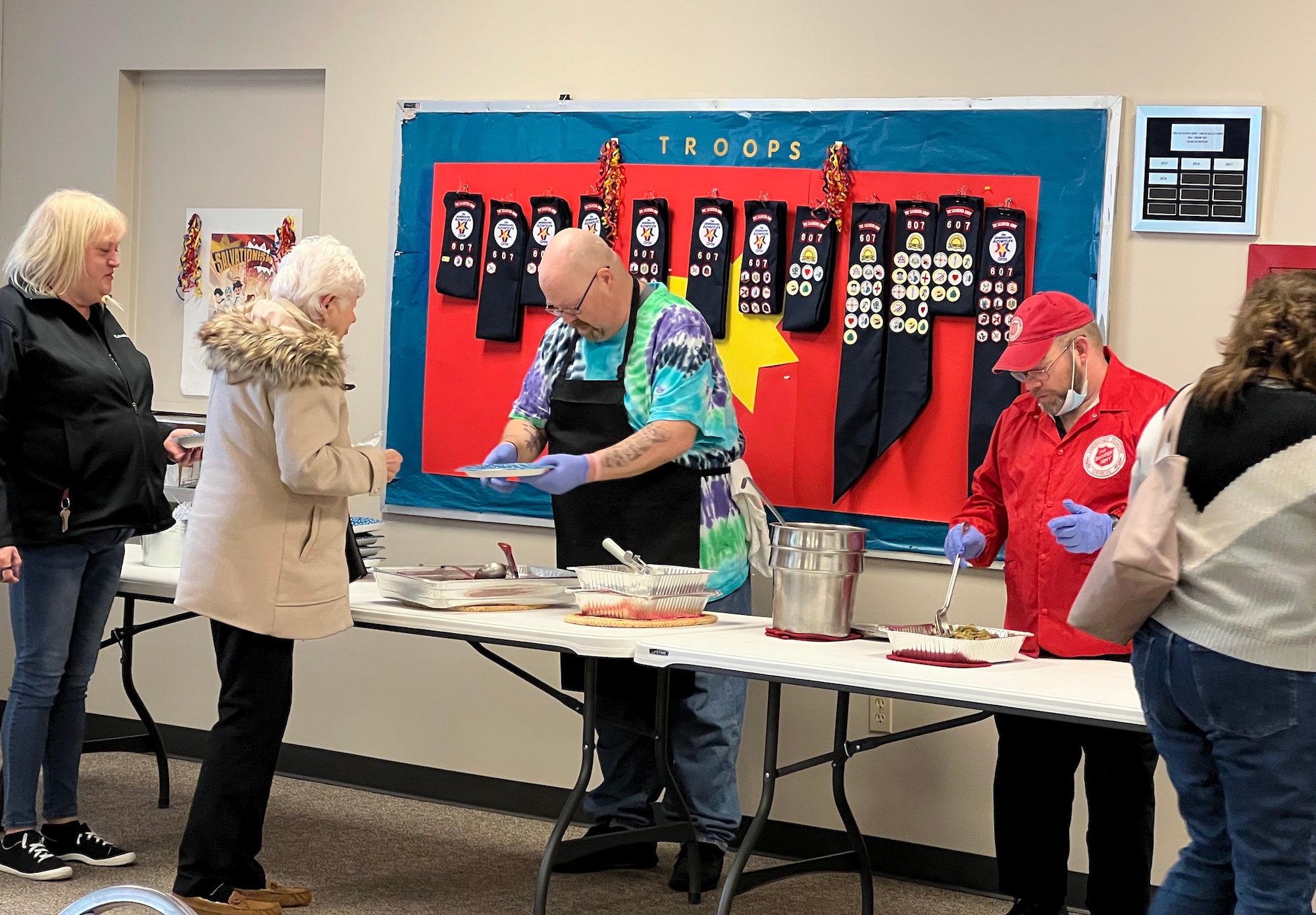 volunteers serving food