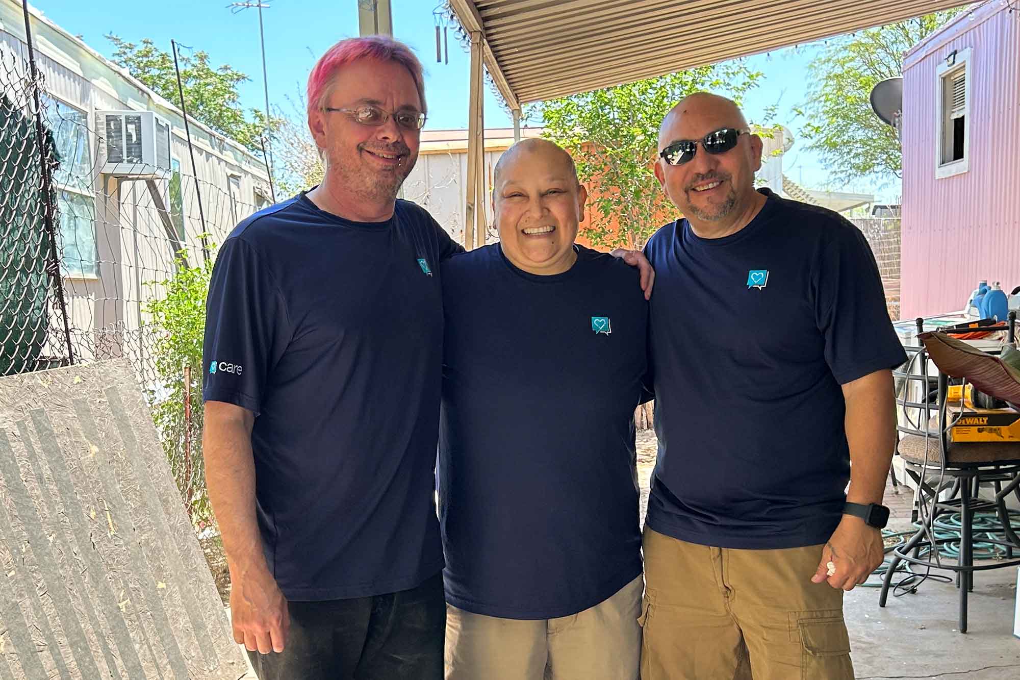 Volunteers Michael Critchley, Marcela Cabrera, Felipe Jimenez help a single mother repair her home.