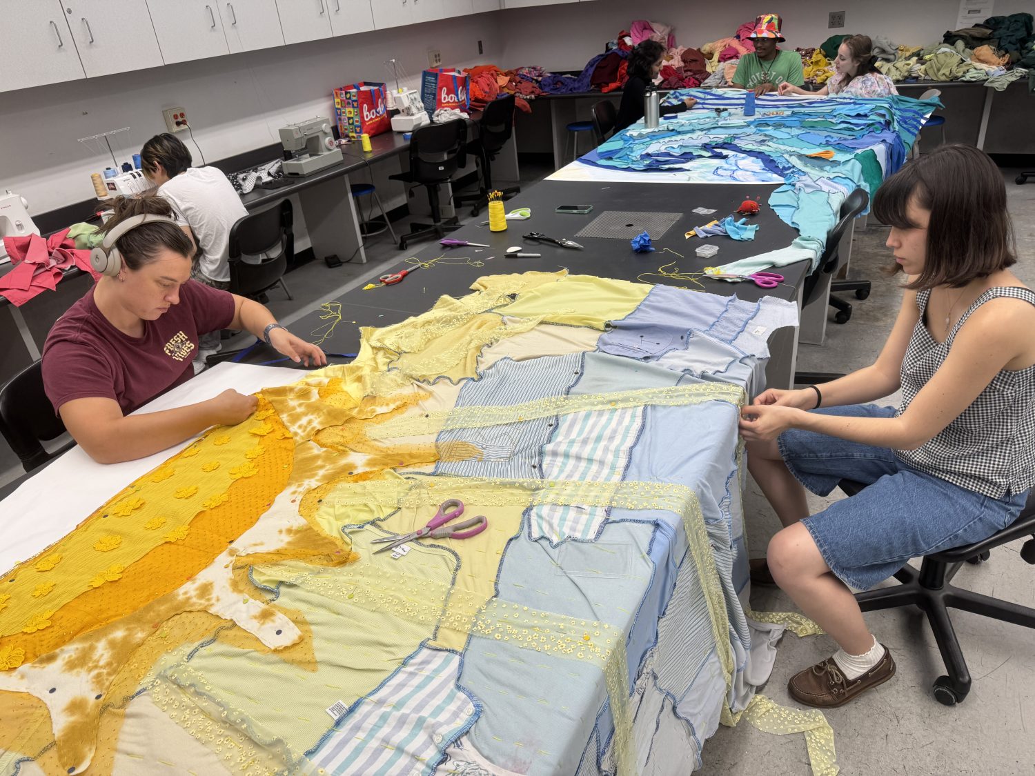 Students craft ocean murals with recycled clothes from The Salvation Army